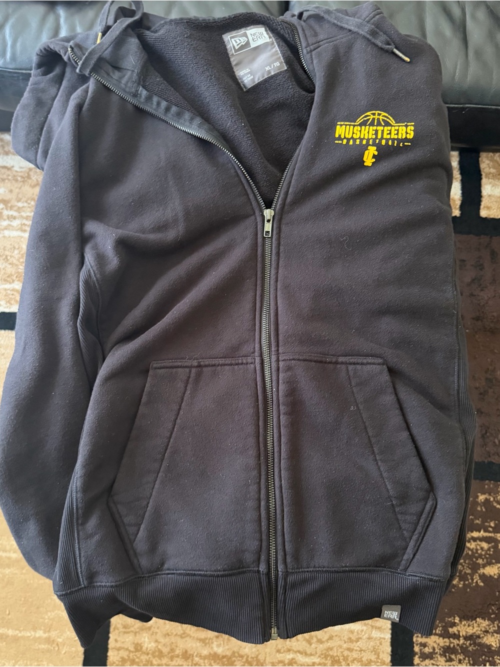 New Era XL Black Hoodie with Yellow MuskeTEERS Logo